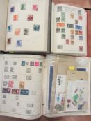 World stamps in 3 albums and a collection of mint and other loose stamps