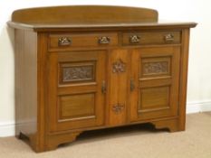 Early 20th century oak Art Nouveau sideboard fitted with two drawers and two cupboards carved