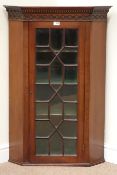 Edwardian mahogany display cabinet enclosed by single astragal glazed door,
