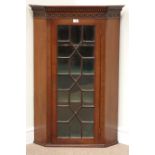 Edwardian mahogany display cabinet enclosed by single astragal glazed door,