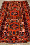 Turkish geometric design red and blue ground rug,