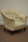 Early 20th century tub shaped armchair upholstered in buttoned fabric, raised on oak feet,