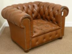 20th century vintage Chesterfield oversized armchair upholstered in antique tan leather,