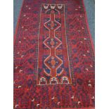 Afghan design red and blue ground rug,