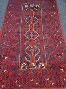 Afghan design red and blue ground rug,