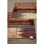 Two Eastern patchwork tribal wall hangings/rugs, approx.
