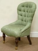 Victorian style spoon back nursing chair with serpentine seat upholstered in buttoned fabric