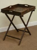 Eastern style carved elm butlers tray on folding stand, 52cm x 72cm,