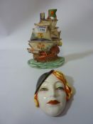 Art Deco period wall mask H16cm and a Ditmar Urbach relief pottery galleon 22.