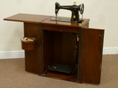 20th century walnut cased singer treadle sewing machine, fitted with hinged top, W53cm, H79cm,