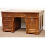 Late 19th century aesthetic movement knee hole desk, fitted with six drawers and single cupboard,