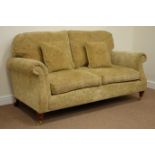 Large two seat sofa upholstered in golden chenille patterned fabric raised on mahogany finish feet,
