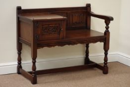 Old Charm medium oak telephone table fitted with single cupboard, linenfold detail,