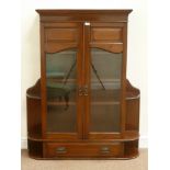 Edwardian mahogany cabinet fitted with two bevelled glass doors and fall front compartment to base,