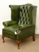'Centurion Furniture' Georgian style wing back armchair upholstered in deeply buttoned antique