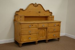 Victorian waxed pine Lincolnshire dresser fitted with seven drawer and centre cupboard below and