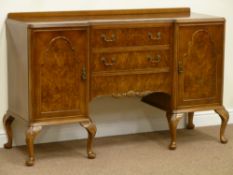 20th century walnut sideboard fitted with three centre drawers and cupboards either side,