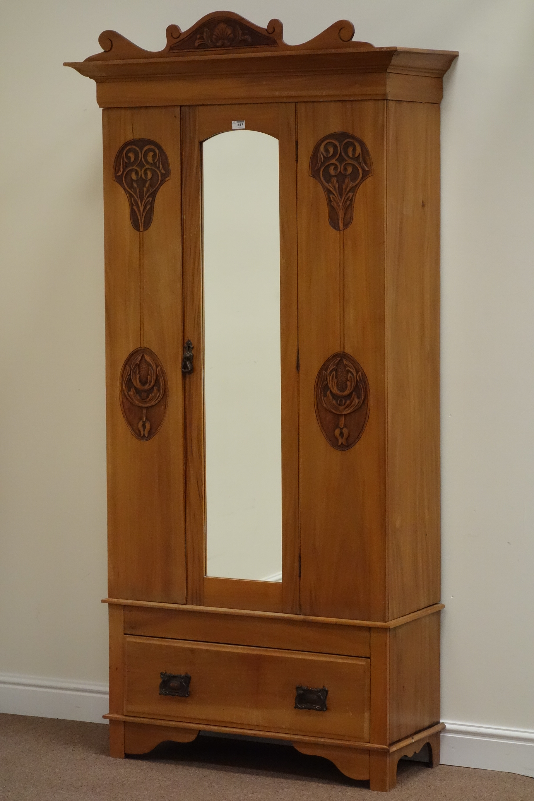 Edwardian satin walnut single wardrobe enclosed by mirror door with drawer to base, carved detail,
