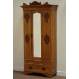 Edwardian satin walnut single wardrobe enclosed by mirror door with drawer to base, carved detail,