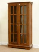 Mahogany bookcase enclosed by two glazed doors, fitted with three shelves, W97cm, H179cm,