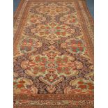 Persian Kerman rug carpet, narrow patterned border, red ground field,