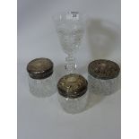Large Edinburgh Crystal cut crystal wine goblet together with three Atlantis glass dressing table