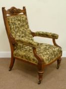 Quality Edwardian golden oak armchair, heavily carved with foliage and shield top pediment,