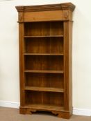 Cherry wood open front bookcase fitted with four shelves, carved and fluted detail, W105cm, H206cm,