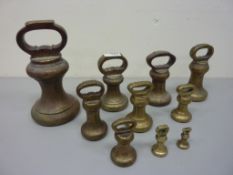 Set of early 20th century Avery graduating solid brass butcher's weights 14lbs diminishing