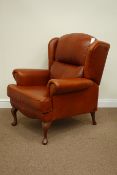 Sherborne wide seat club armchair, upholstered in rust coloured leather,