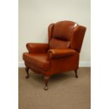 Sherborne wide seat club armchair, upholstered in rust coloured leather,