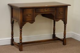 Reproduction oak kneehole desk/lowboy fitted with three drawers, W101cm, H75cm, D50cm,