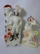 Staffordshire figure of a man with a parrot H34cm and a Staffordshire spill vase 43cm (2)
