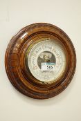 20th century circular carved walnut framed aneroid barometer made in Germany,