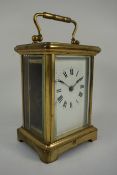 Early 20th century French brass carriage clock, bevel edged glass panels, H14.