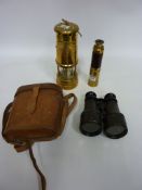 Wood and brass three draw telescope, a miners lamp and early 20th century binoculars by W.