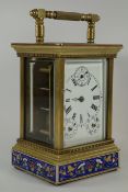 Brass and Cloisonne enamel carriage clock fitted with bevelled glass panels,