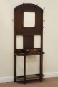Early 20th century oak hallstand, centre bevelled mirror, fitted with eight hooks, W76cm, H188cm,