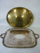 Early 20th century heavy silver-plated twin handled tray and an oval brass tray (2)
