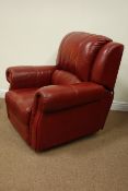 Red leather upholstered electric reclining armchair,