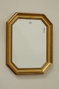 Beveled edge mirror in gilt frame with canted corners,