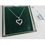 White gold heart pendant set with diamond baguettes stamped 14ct on chain hallmarked 18ct