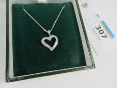 White gold heart pendant set with diamond baguettes stamped 14ct on chain hallmarked 18ct