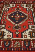 Persian Hamadan woollen red ground rug,