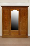 Edwardian inlaid mahogany triple wardrobe fitted with centre bevelled mirror,