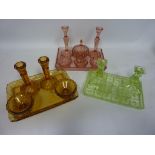 Three Art Deco period coloured glass dressing table sets