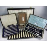 Silver photograph frame, set of tea knives with hallmarked silver handles,