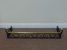 Cast iron fender with brass rail,