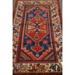 Persian Hamadan red, blue and beige ground rug,
