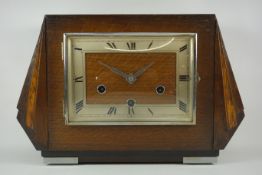 Early 20th century Art Deco oak cased mantel clock, H22cm,